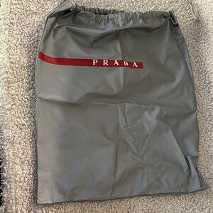 Prada Silver Dust Bag with Red Logo